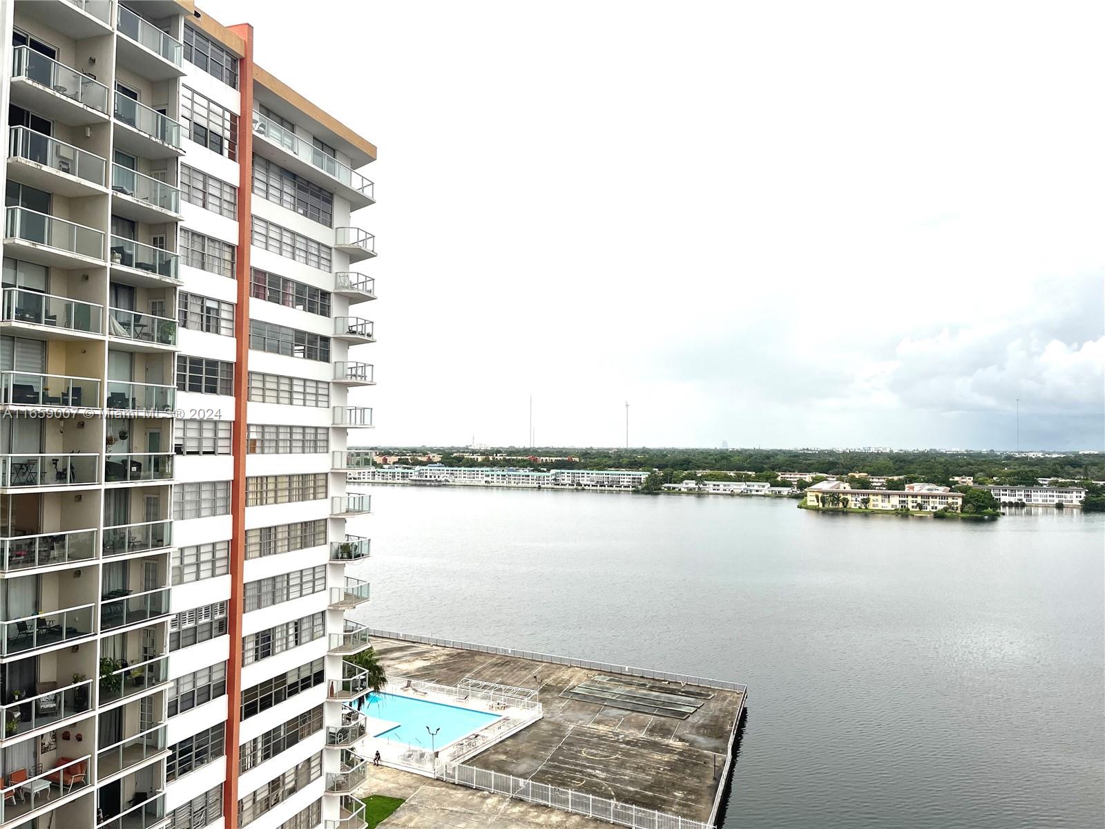 a view of a lake and building in front of it