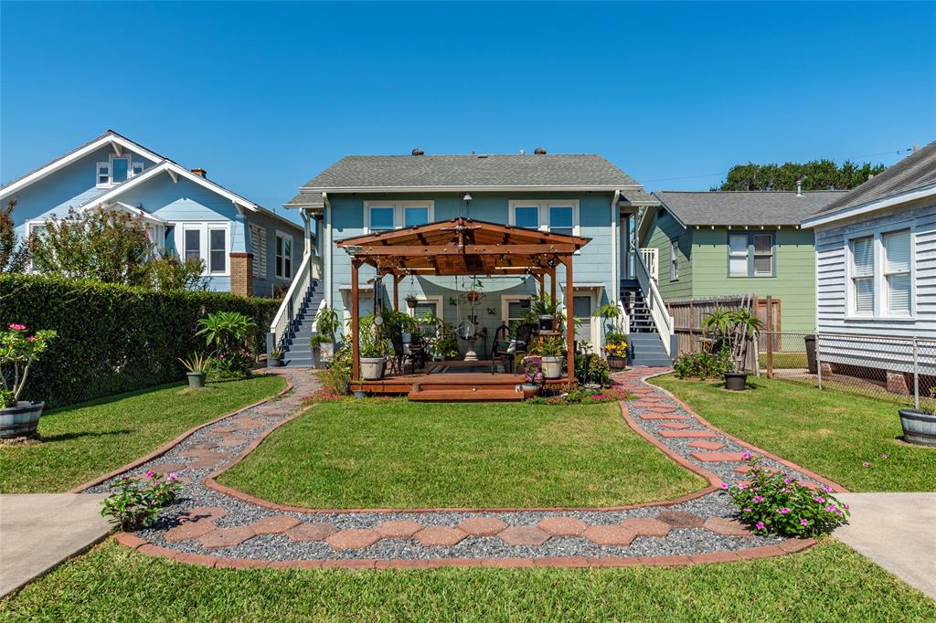 a front view of a house with swimming pool having outdoor seating