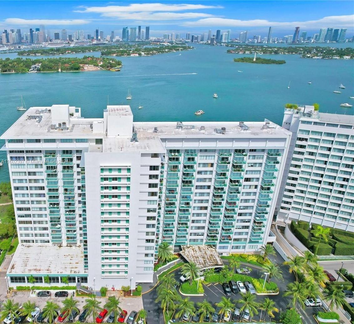 an aerial view of a city with lake view