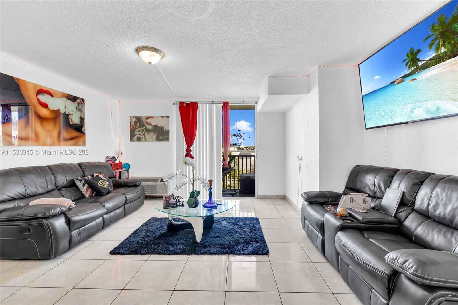 a living room with furniture and a rug