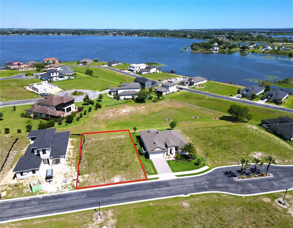 an aerial view of a residential houses with outdoor space