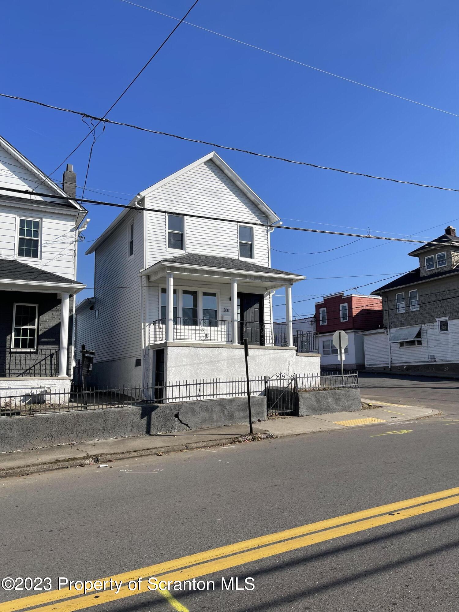 a view of building with car parked