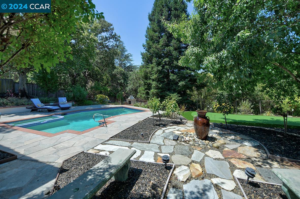 a view of a backyard with sitting area