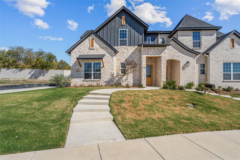 a front view of a house with a yard