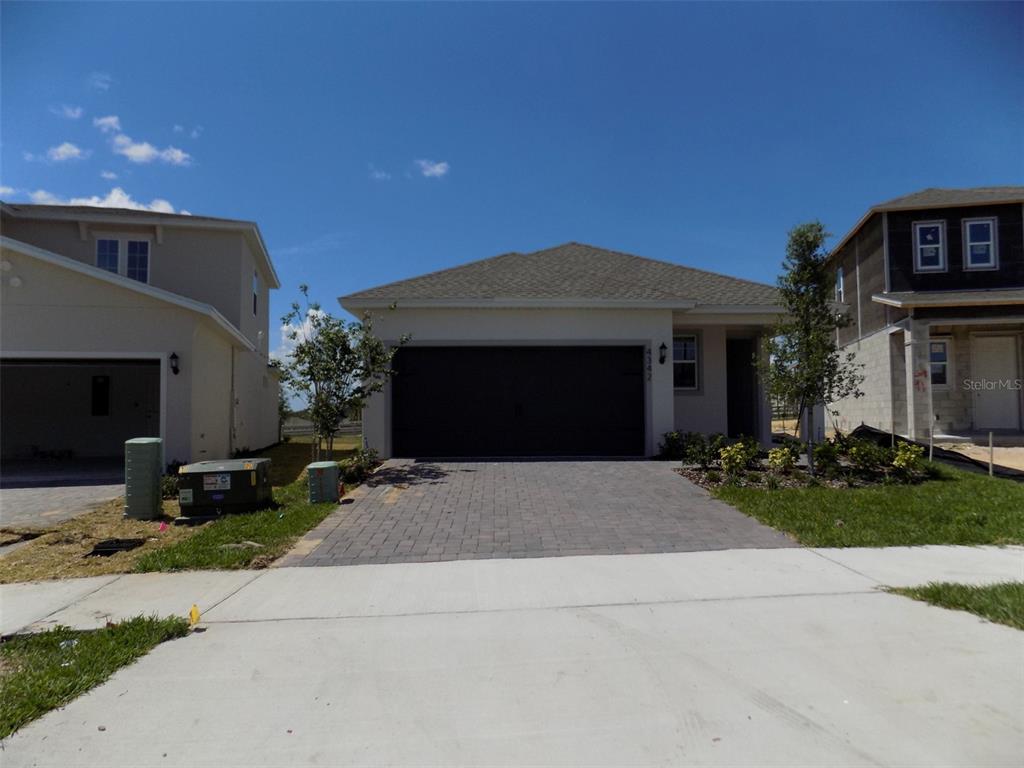 a front view of a house with yard