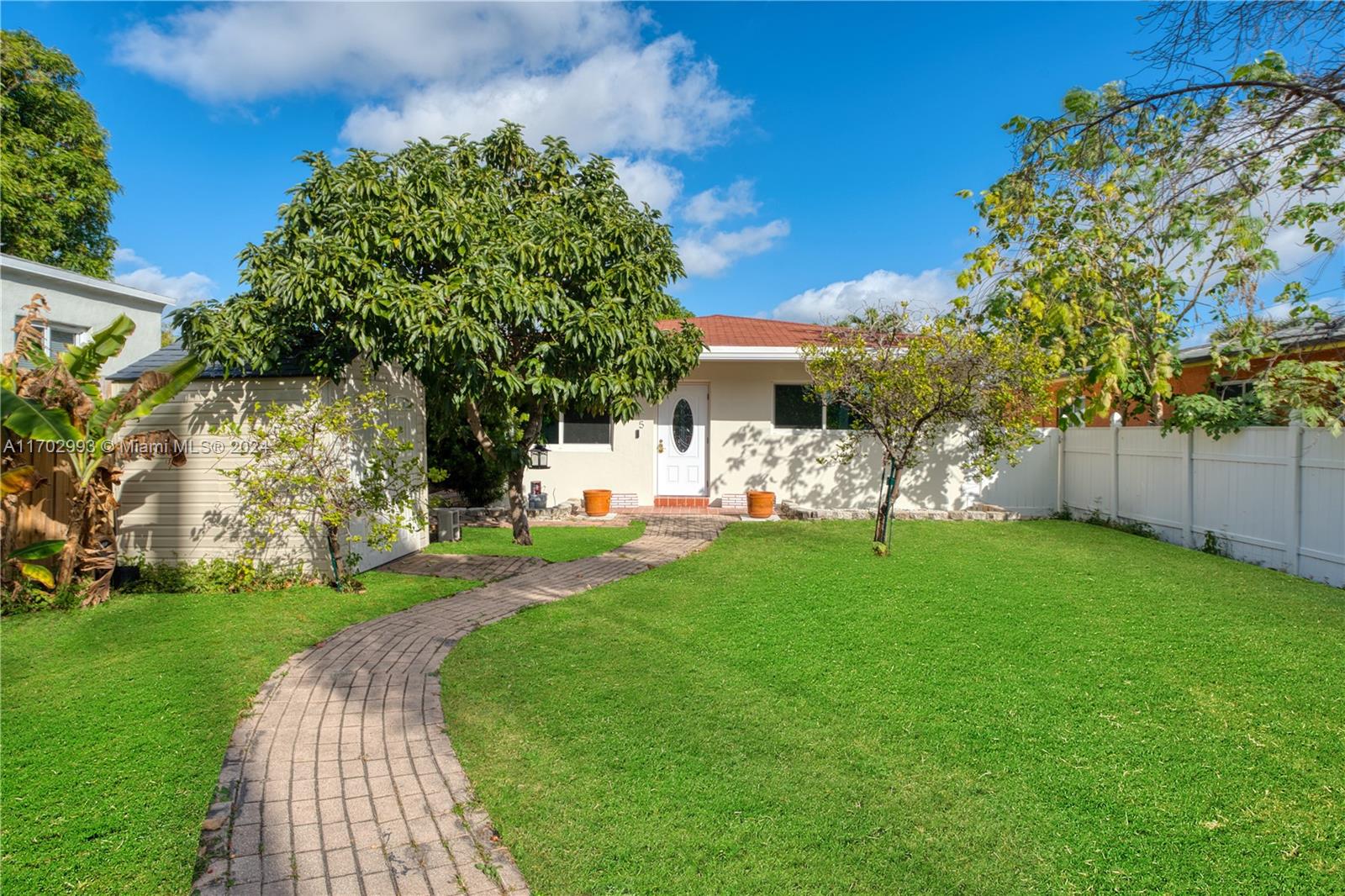 a view of a backyard with garden