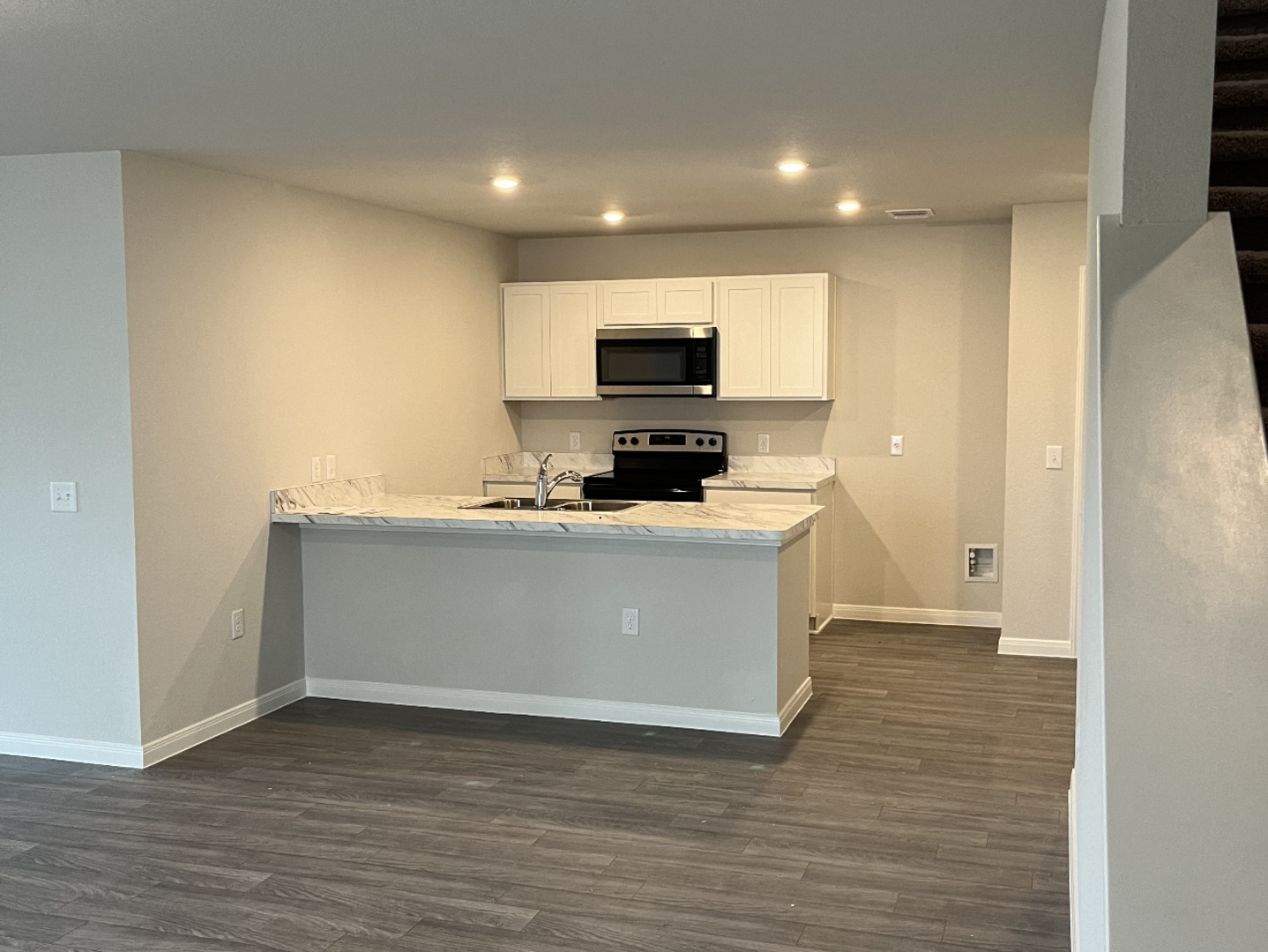 a view living room with a sink and a flat screen tv