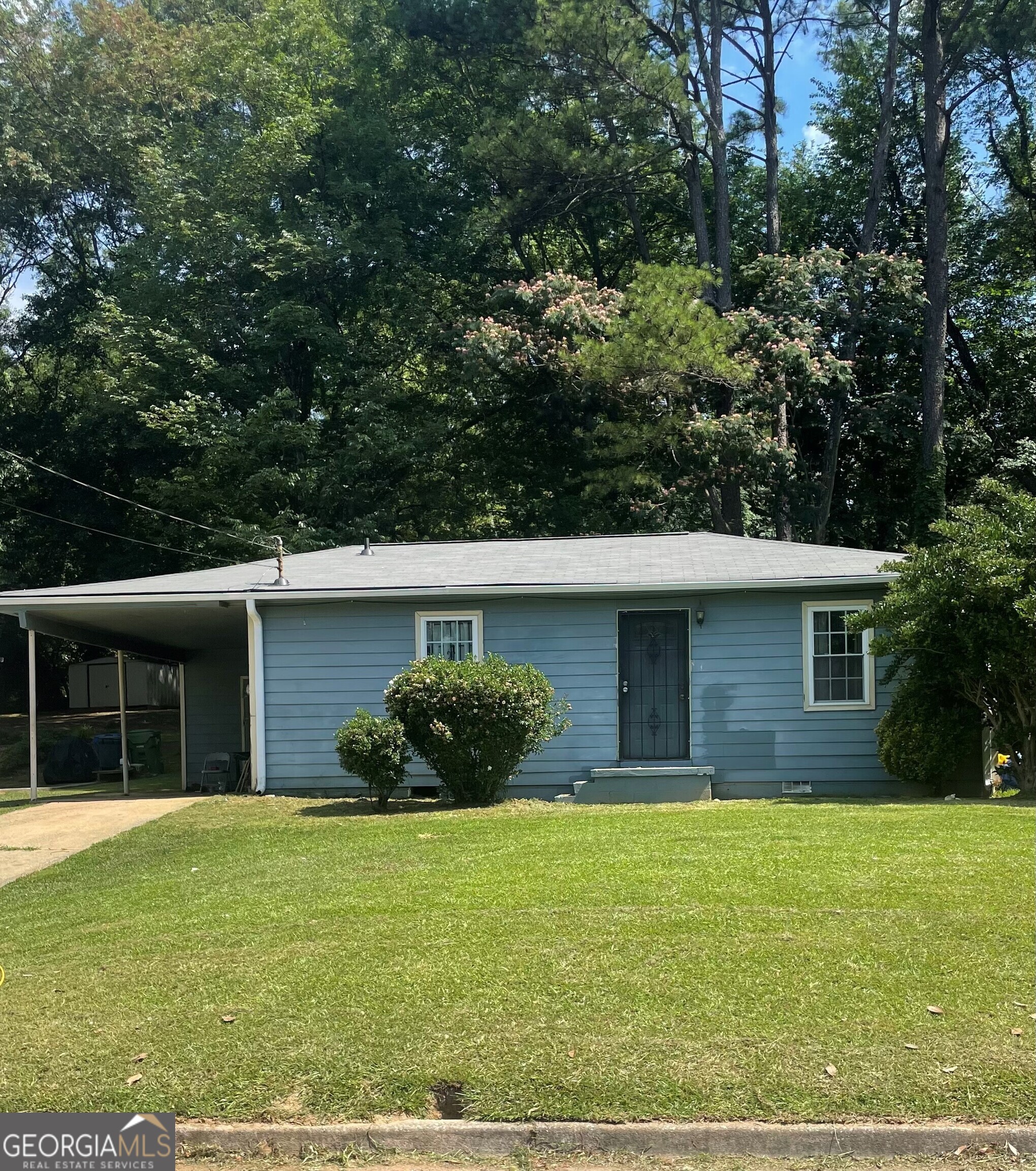 a front view of a house with garden