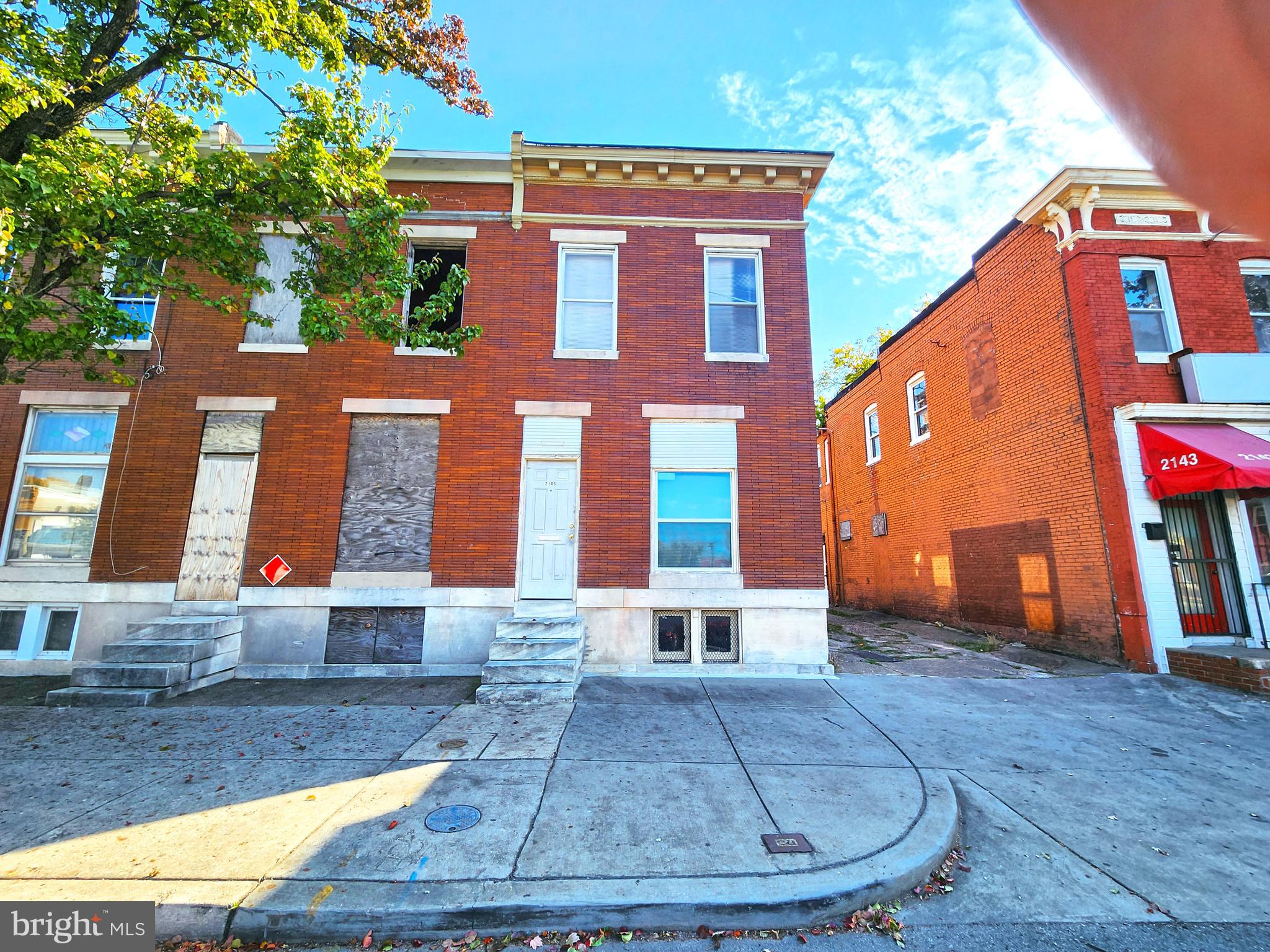 a view of a brick building with many windows