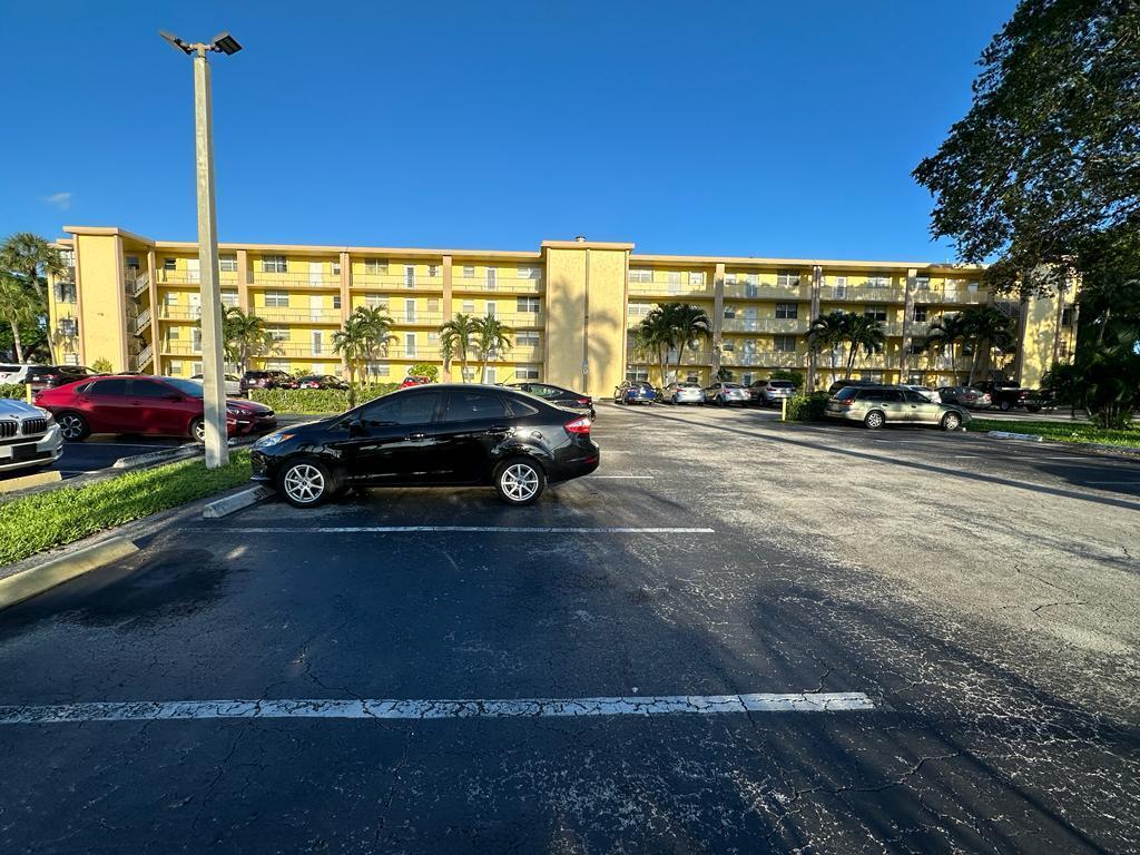 a view of street with parked cars