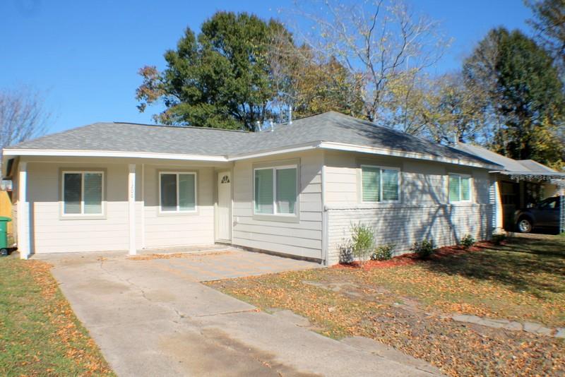 A single-story suburban house with a new roof, freshly painted inside and out, and new energy efficient windows.