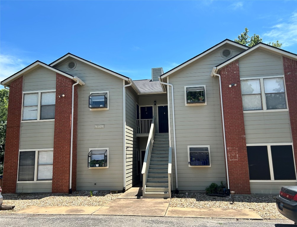 a front view of a house with a wooden house