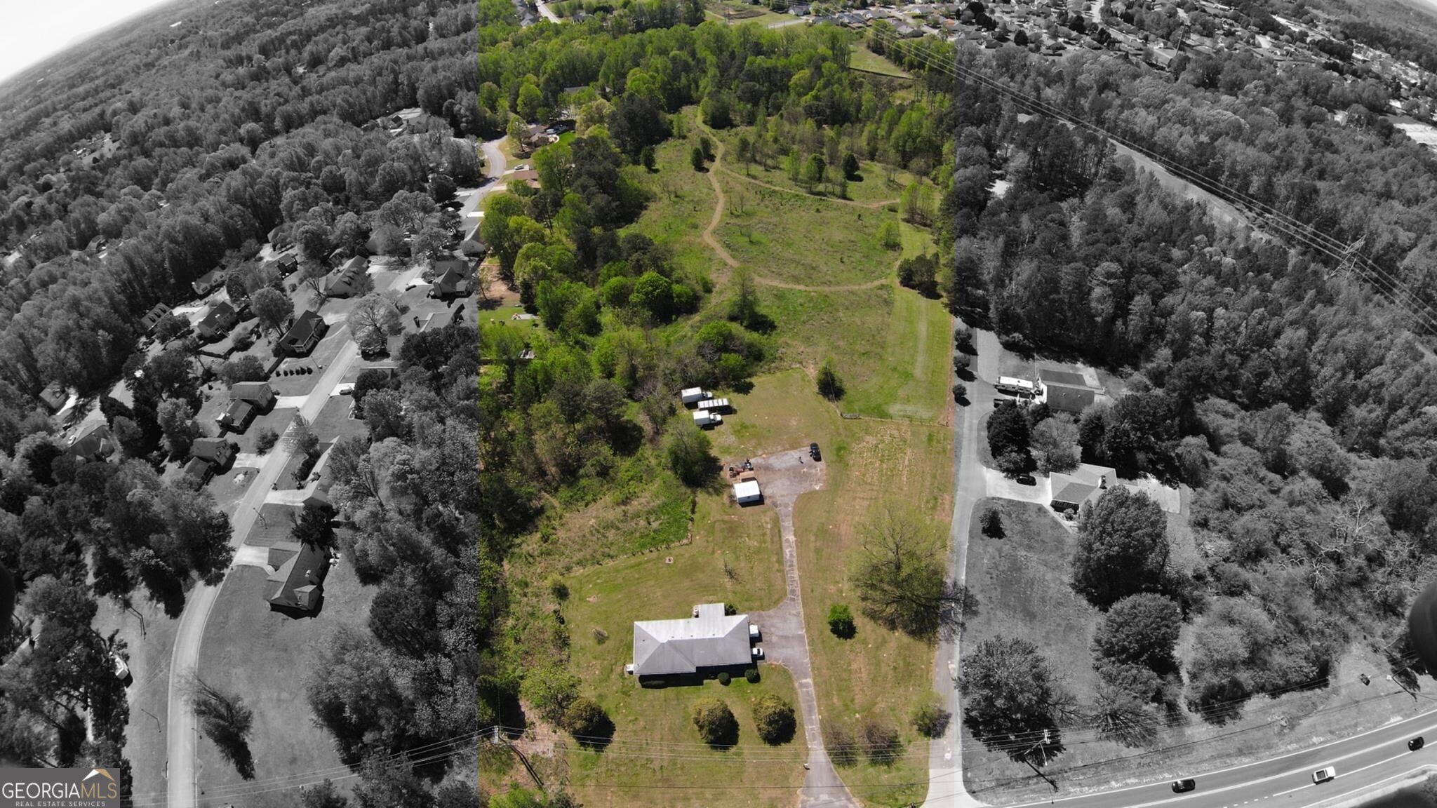 an aerial view of residential houses with outdoor space