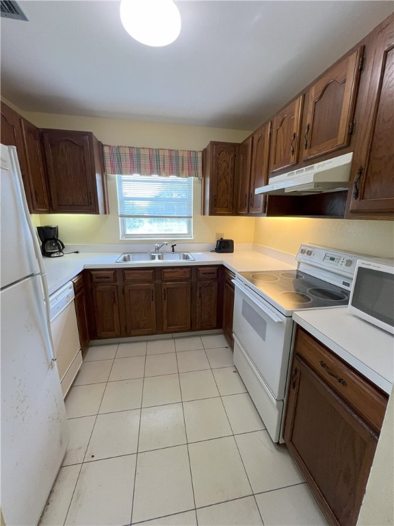 a kitchen with a cabinets sink and appliances