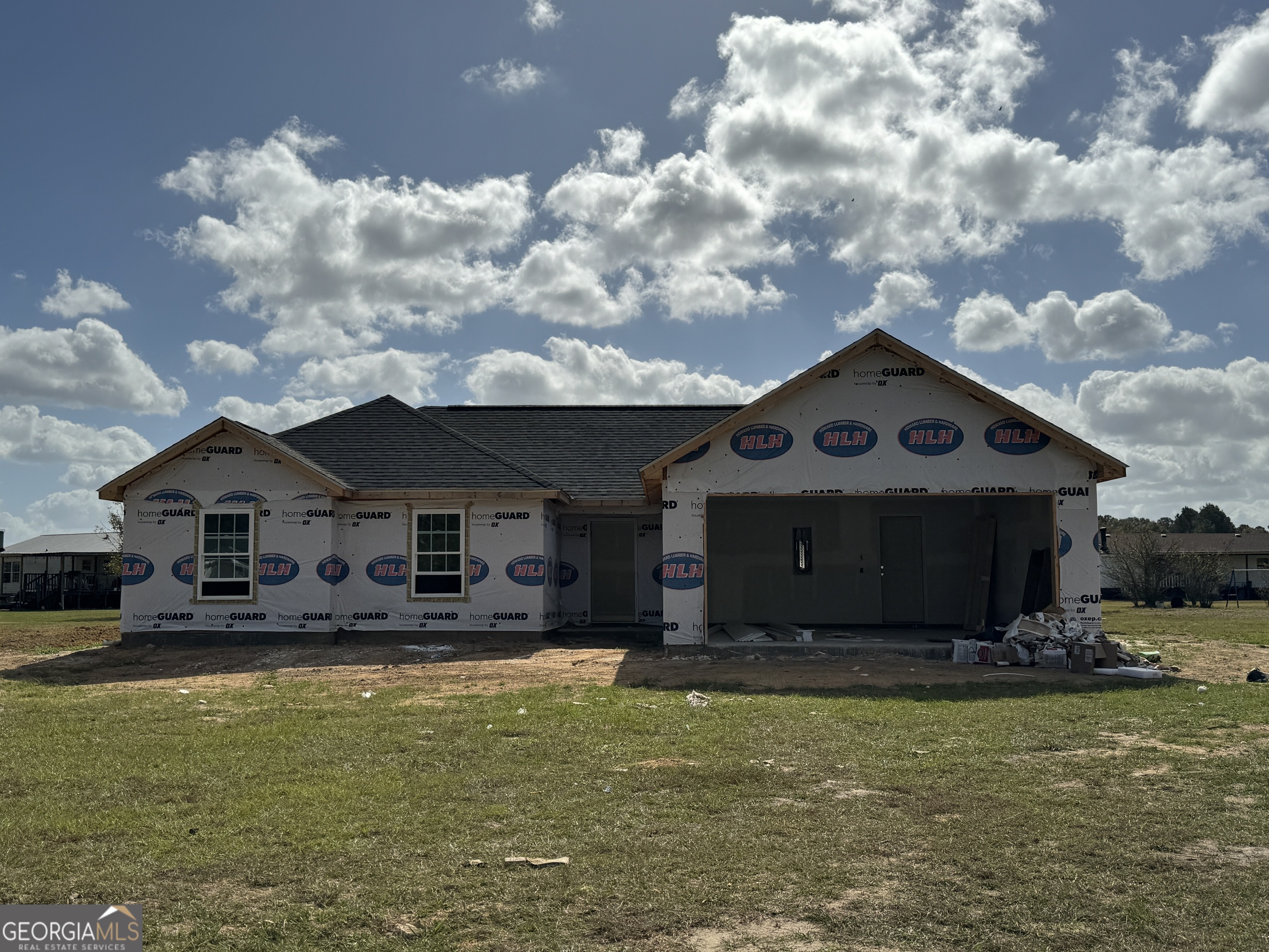 a front view of a house with a yard