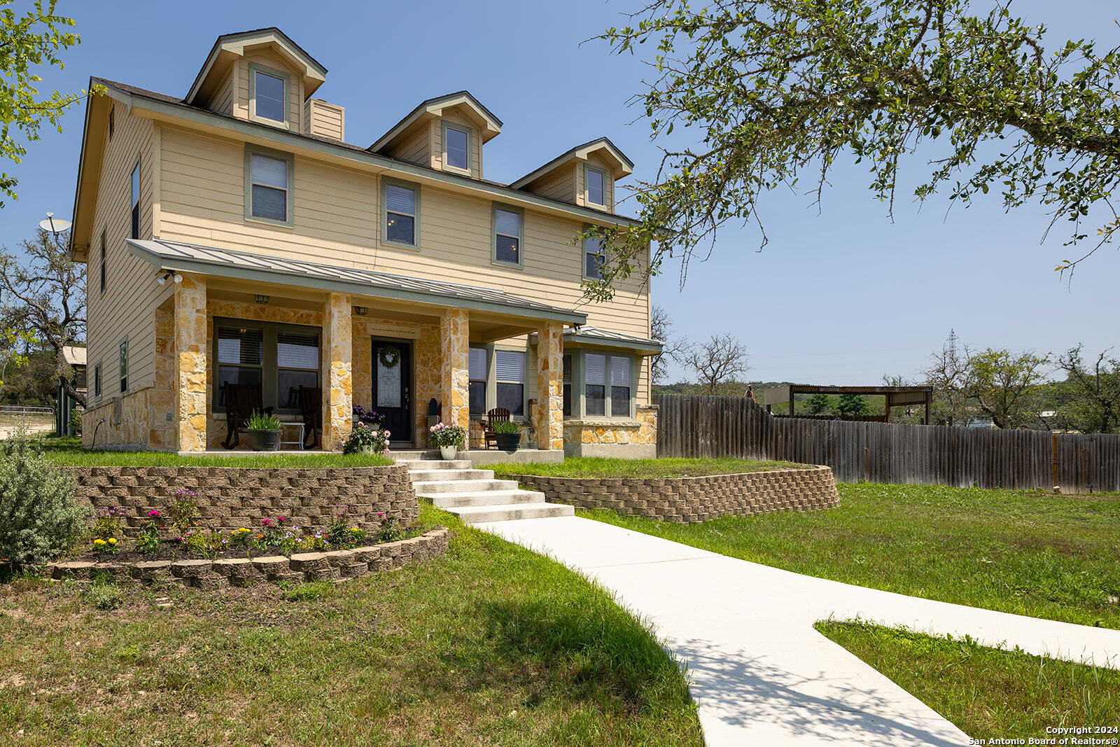 a front view of a house with garden