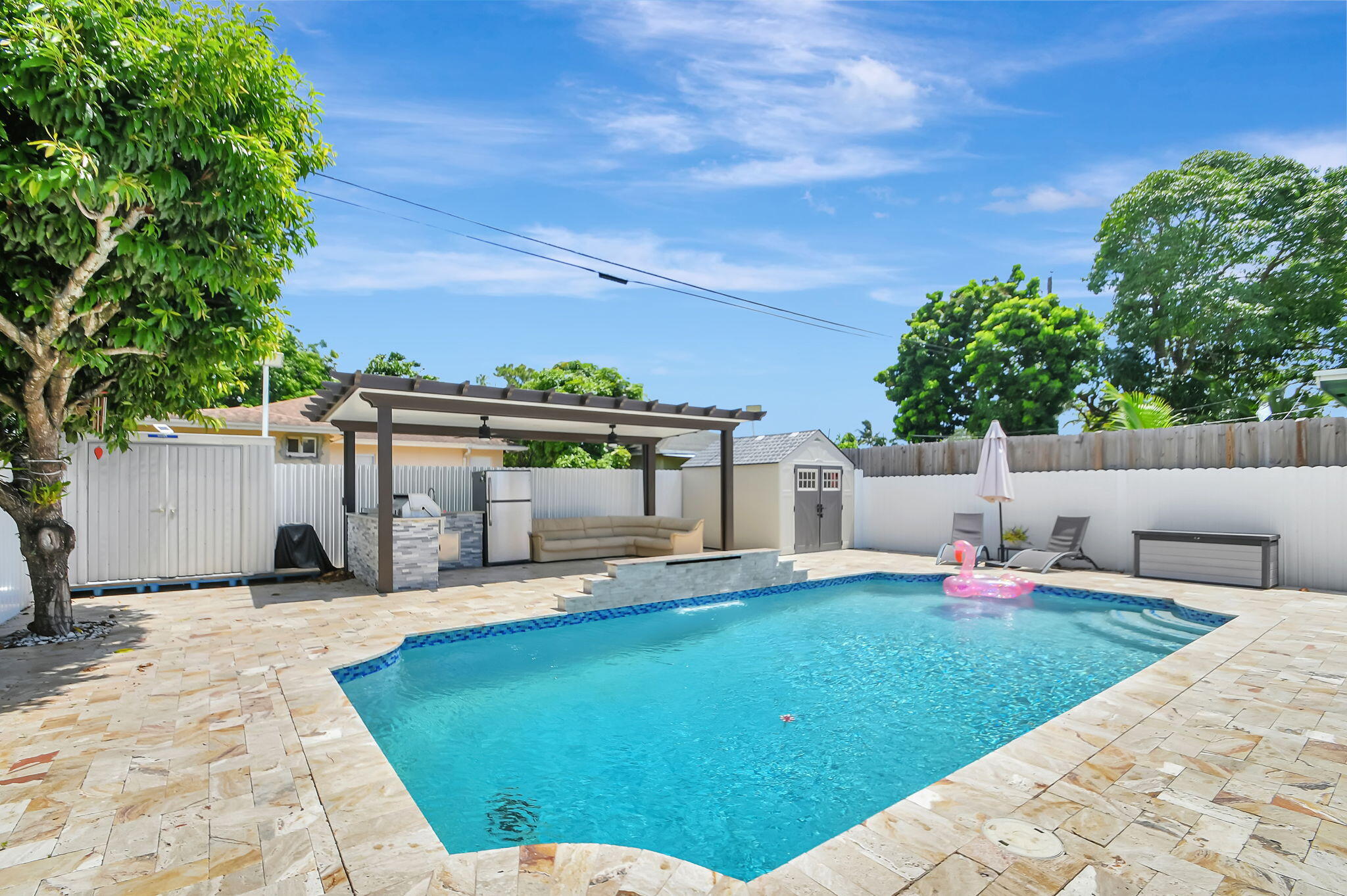 a view of a backyard with furniture