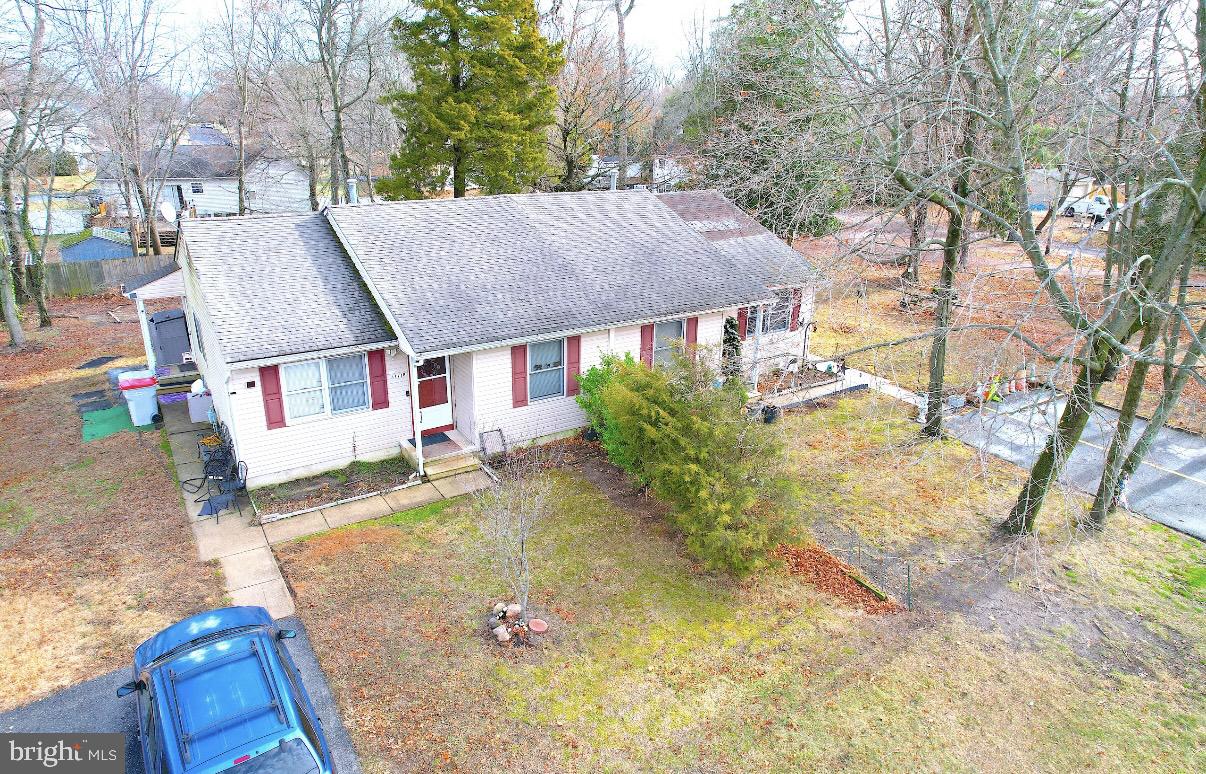 a aerial view of a house with swimming pool