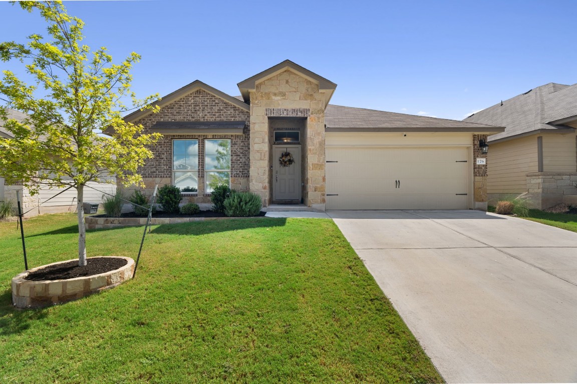 Welcome to this immaculately maintained single-story home in the highly sought-after Grove at Bull Creek community in Taylor, TX.