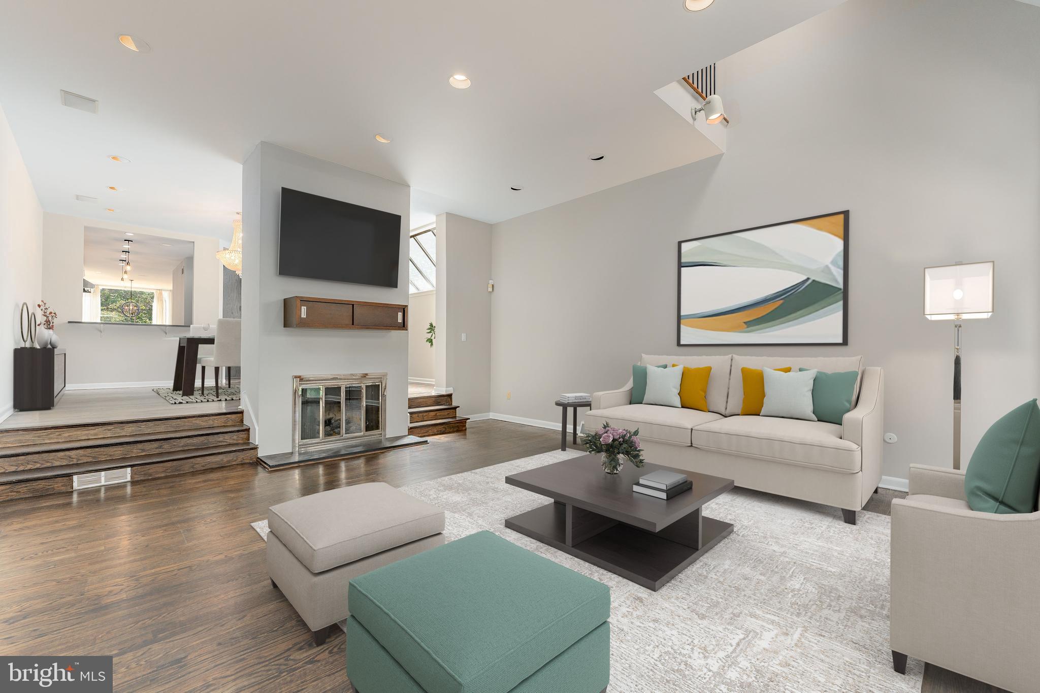 a living room with fireplace furniture and a flat screen tv