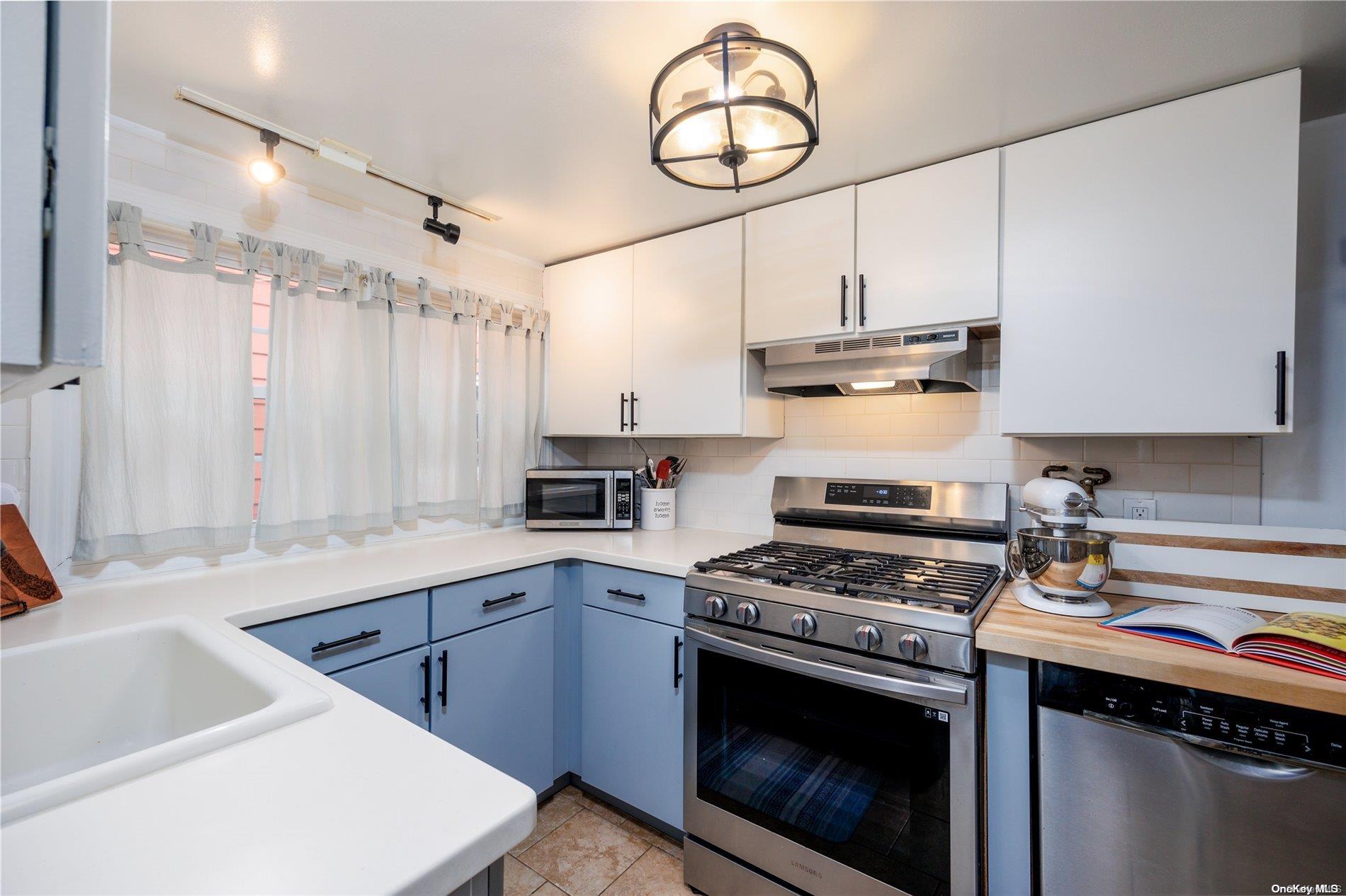 Kitchen with Gas Stove, Dishwasher, and Microwave