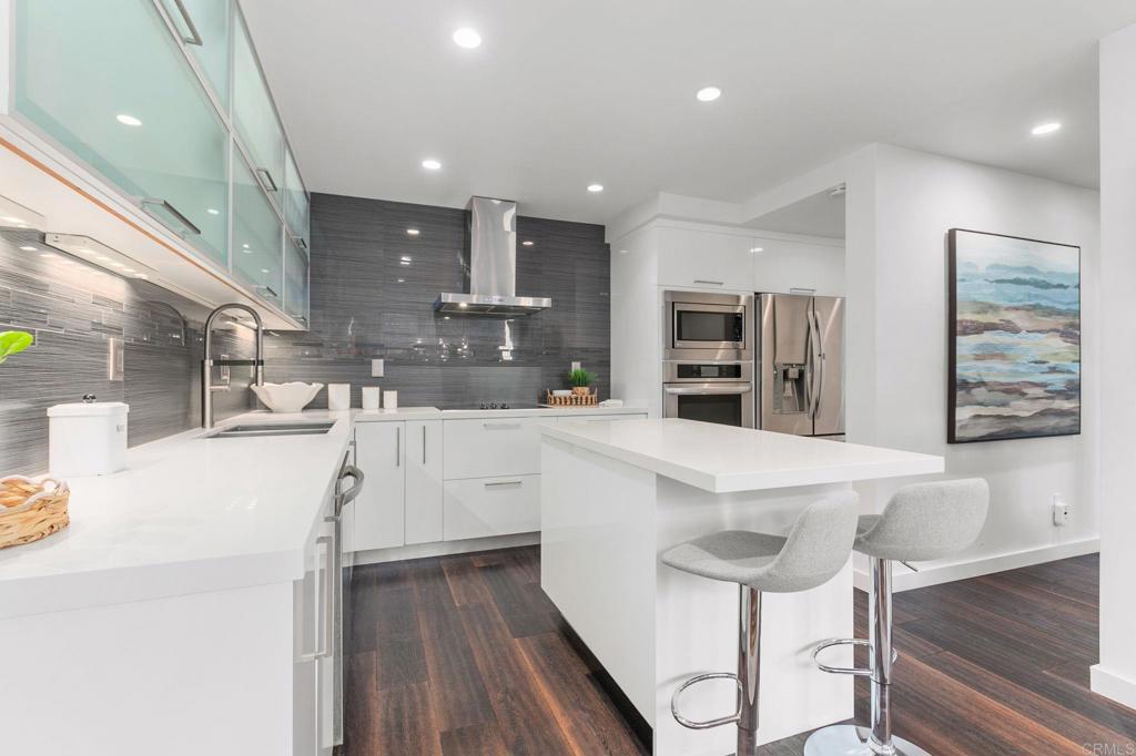 a view of kitchen with cabinets and wooden floor