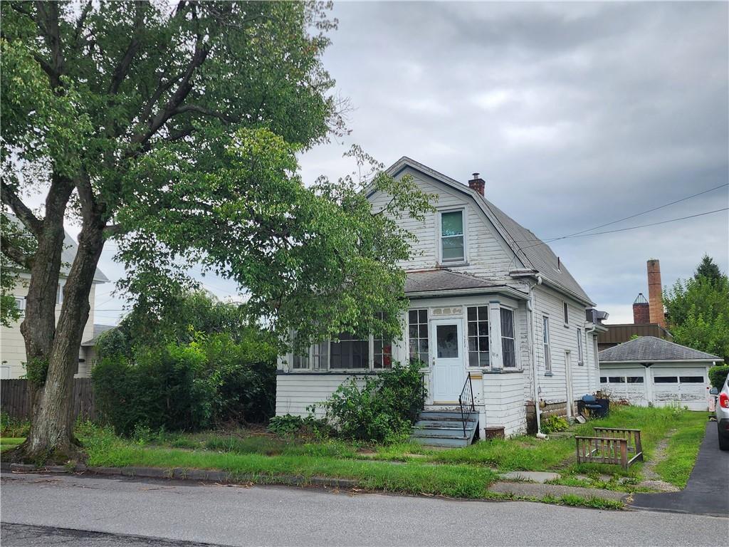 View of front of property with a garage