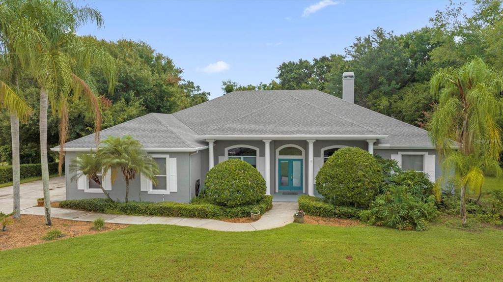 front view of a house with a yard