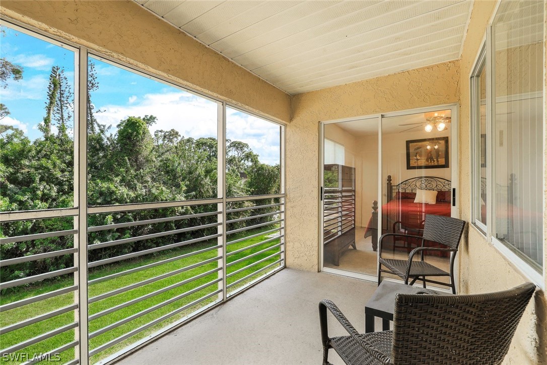 a view of balcony with furniture