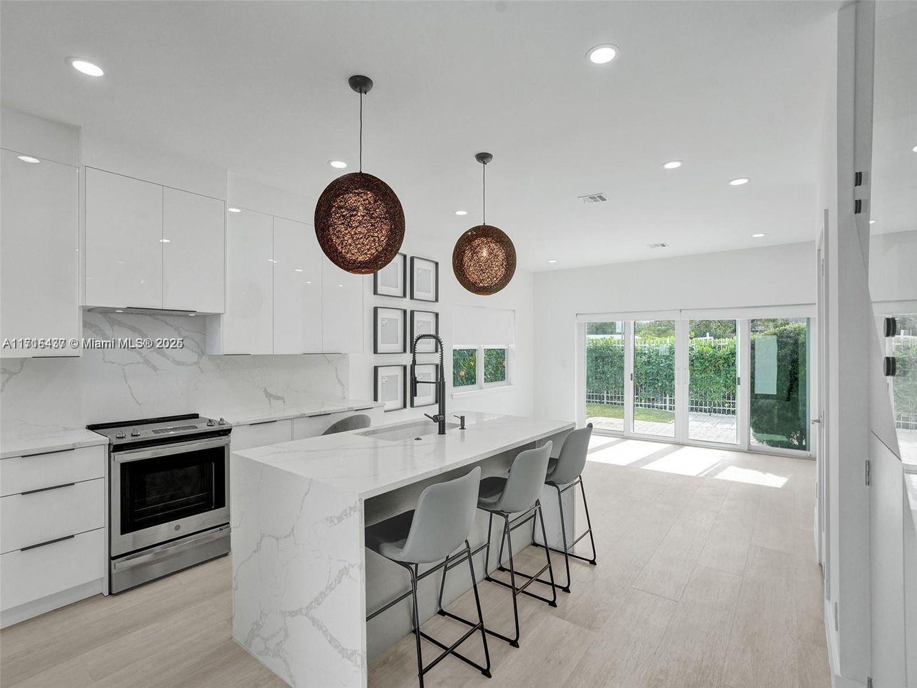 a kitchen with a table and chairs