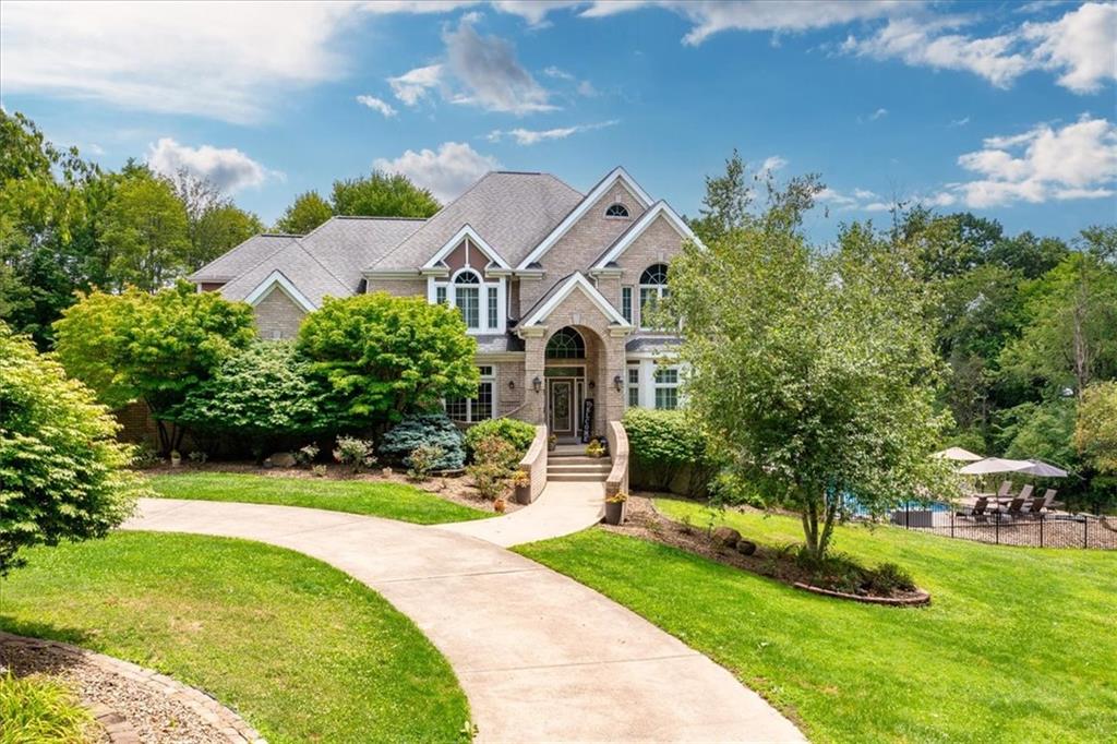 Front view of the home coming from the long driveway off the cul-de-sac. Also notice the governor's driveway.