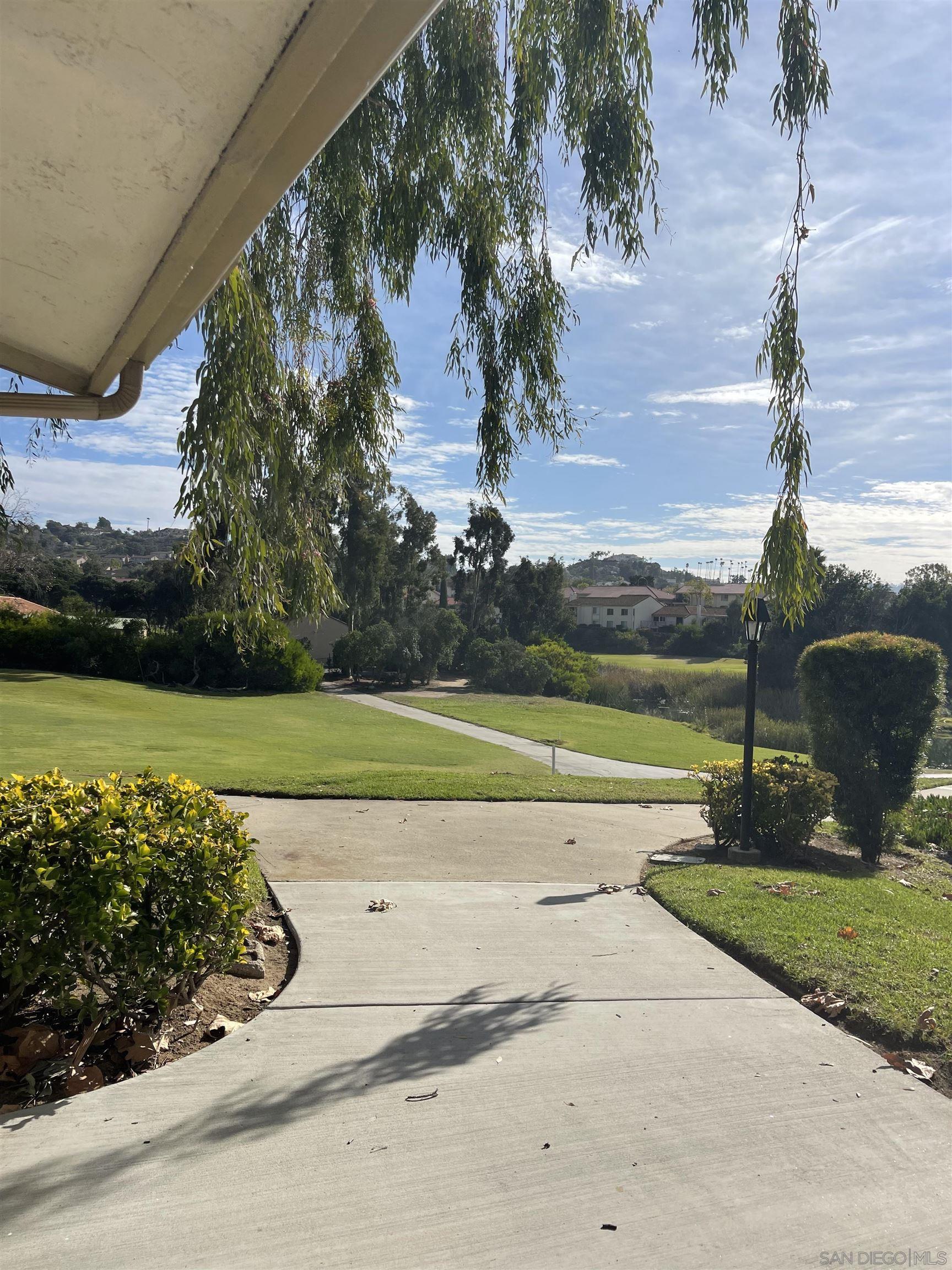 a view of a swimming pool and a yard