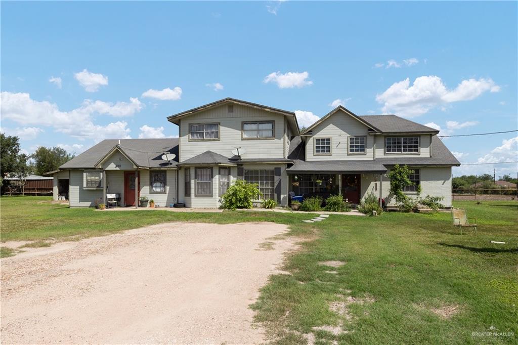 View of front of property featuring a front yard