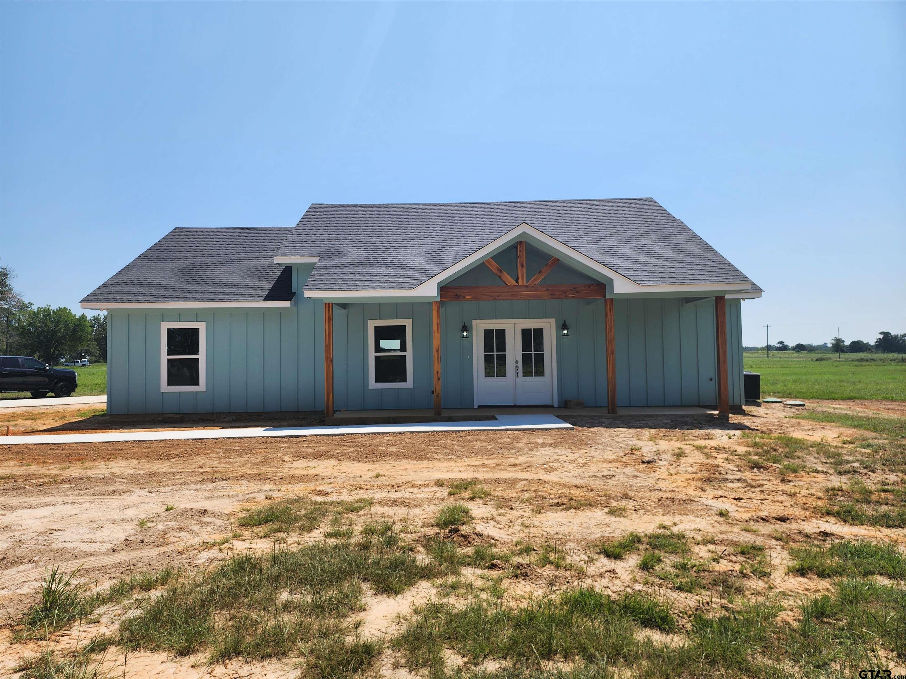 a house with yard in front of it