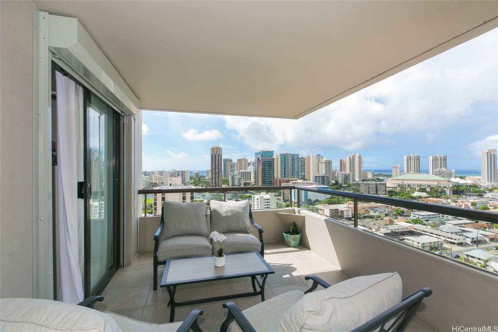 a terrace with outdoor seating and city view