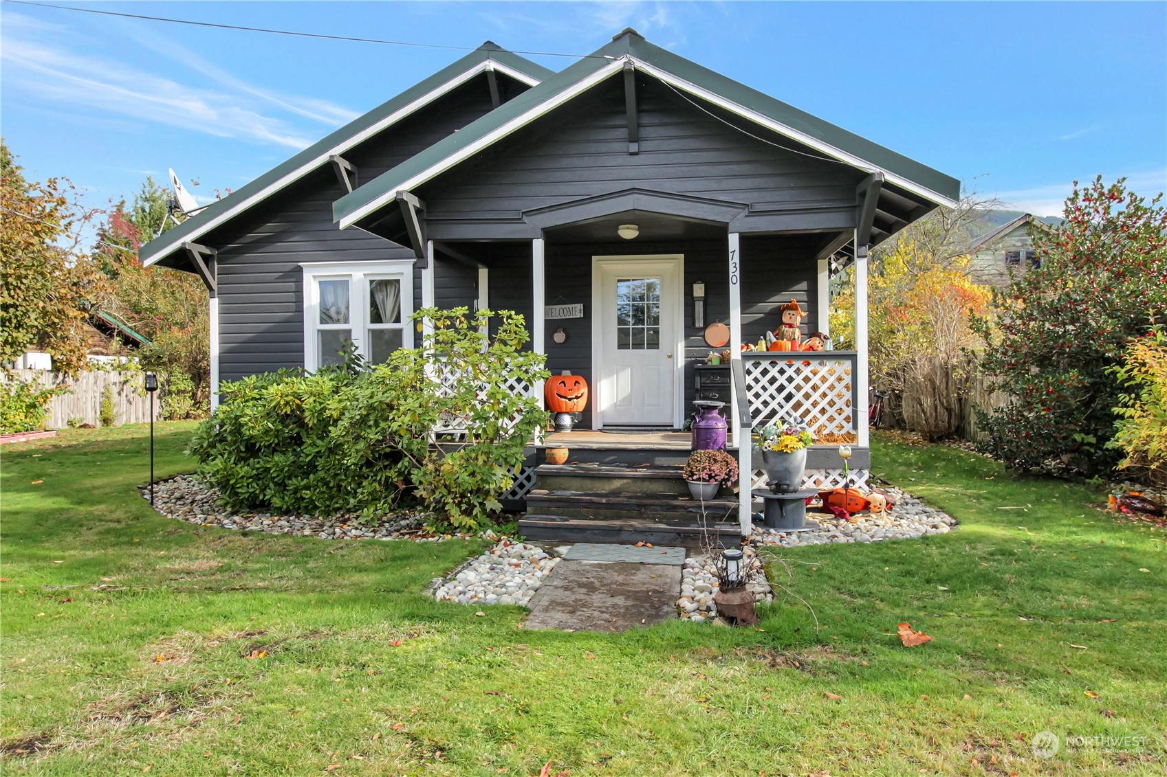 a front view of a house with garden