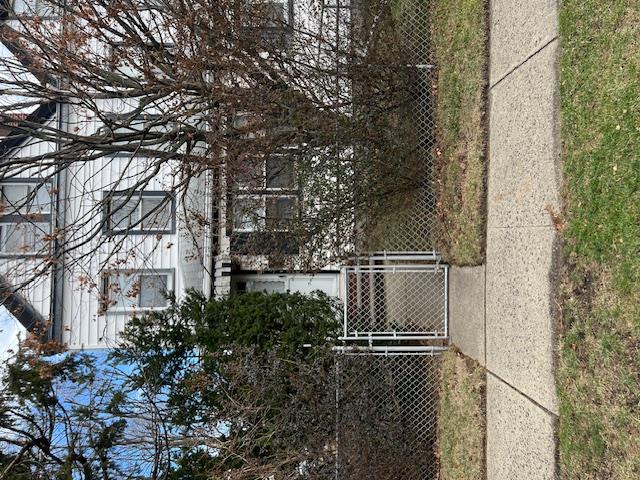 a view of a house with a tree