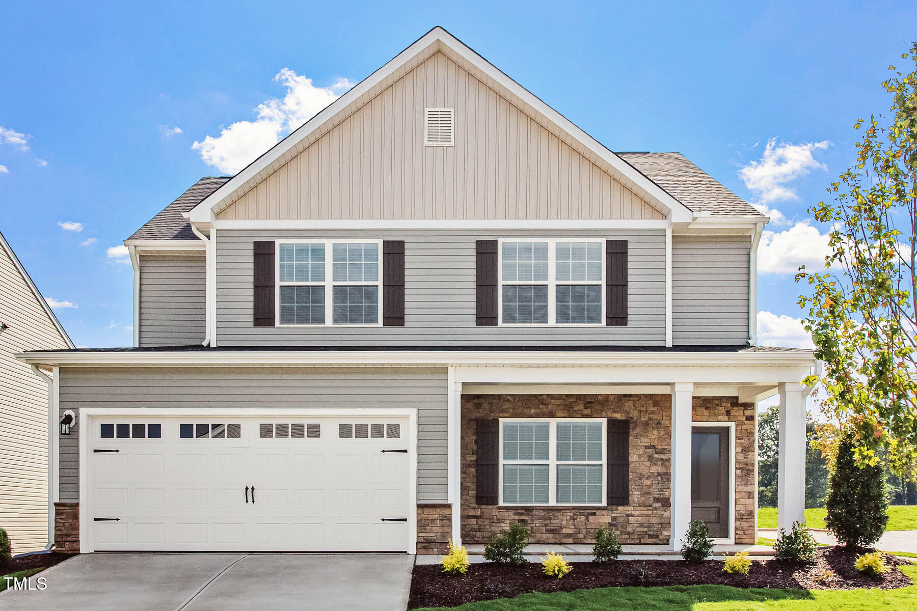 a front view of a house with yard