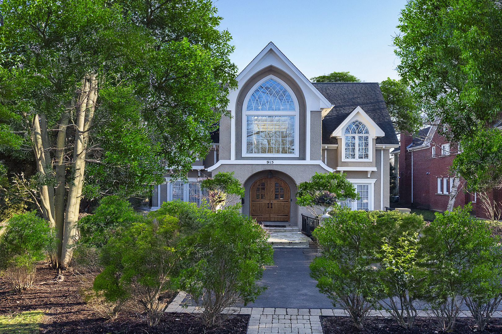 a front view of a house with garden