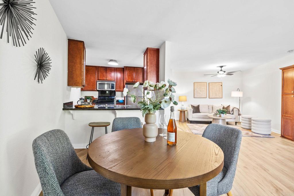 a dining room with furniture and wooden floor