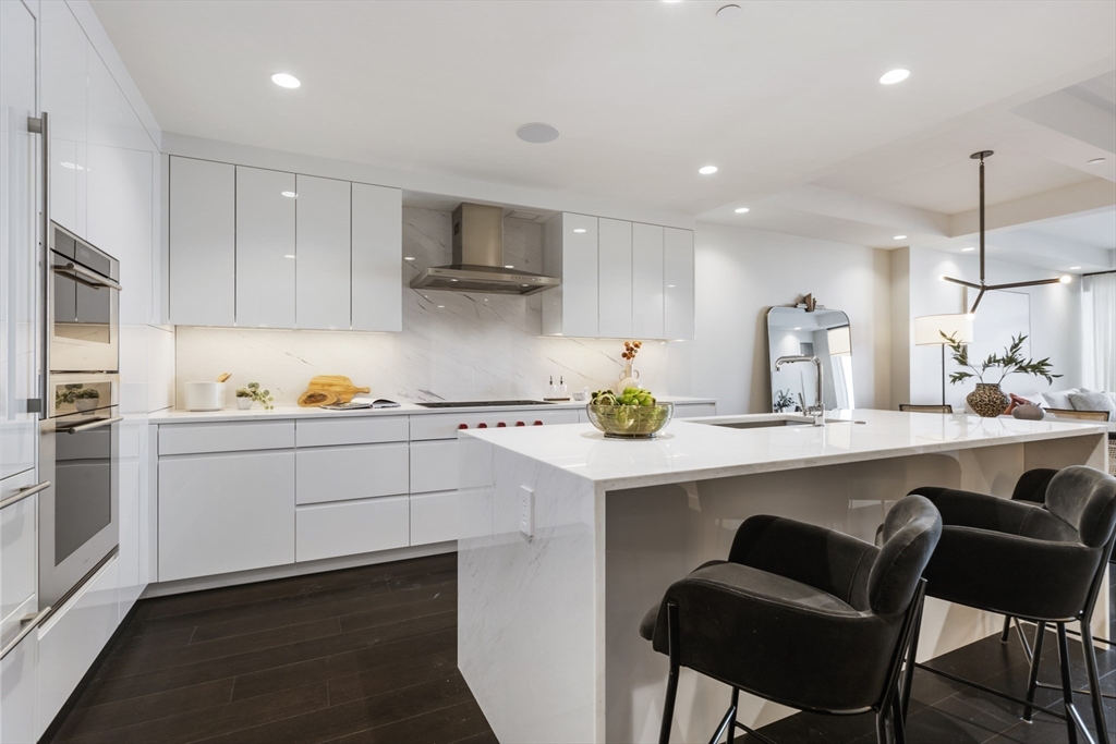 a kitchen with a sink cabinets and window