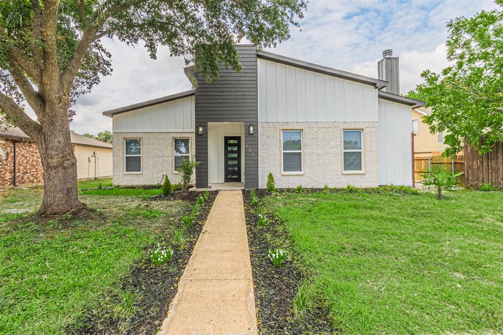 front view of a house with a yard