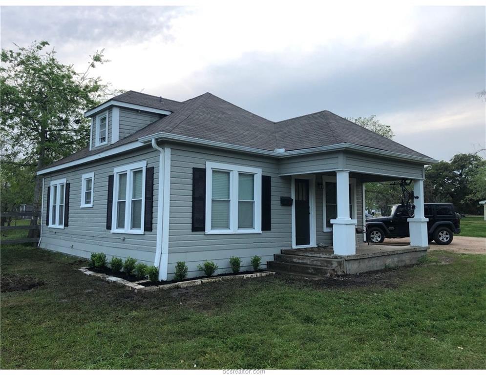 View of front of home featuring covered porch and