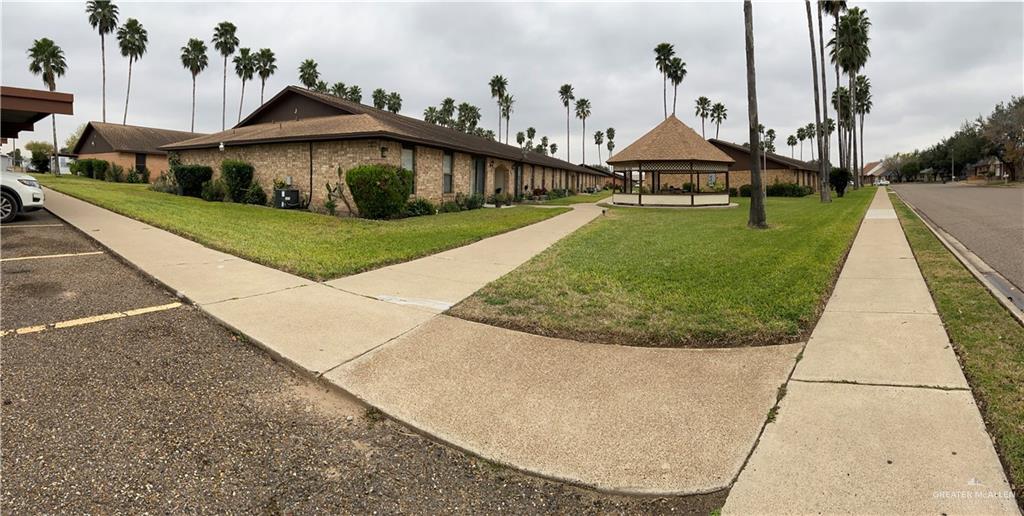 a view of a house with a yard