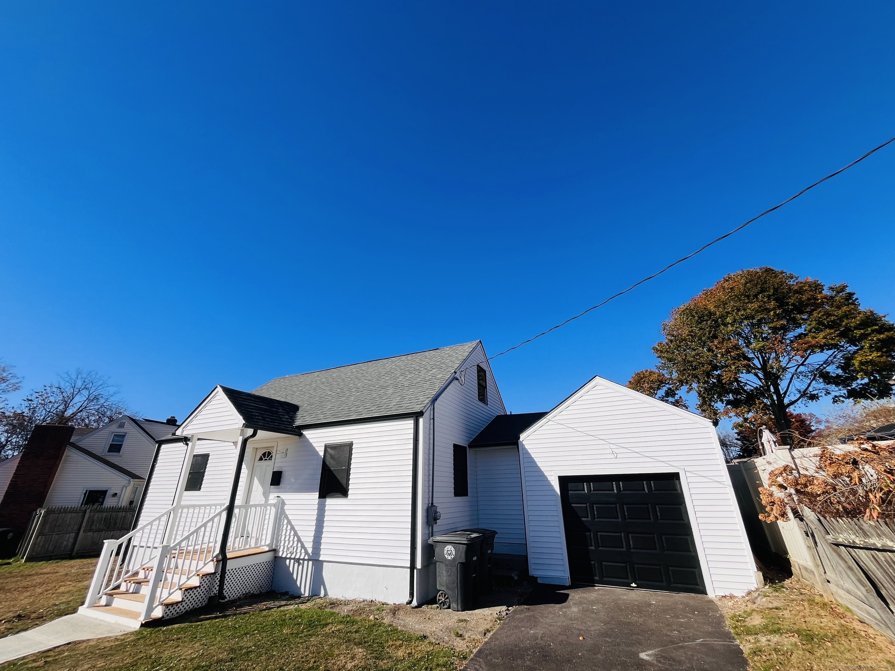 a view of a house with a backyard