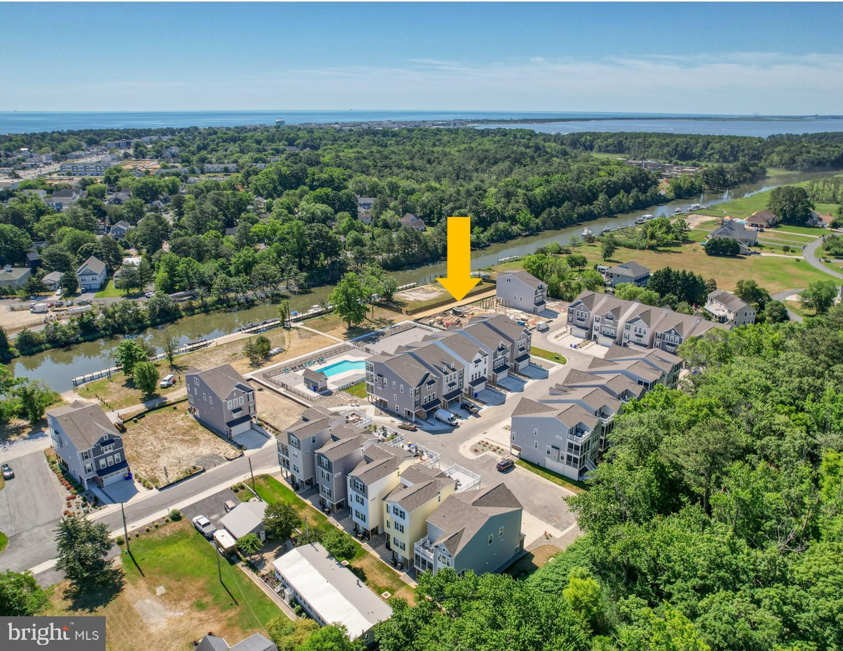 an aerial view of a house with a swimming pool