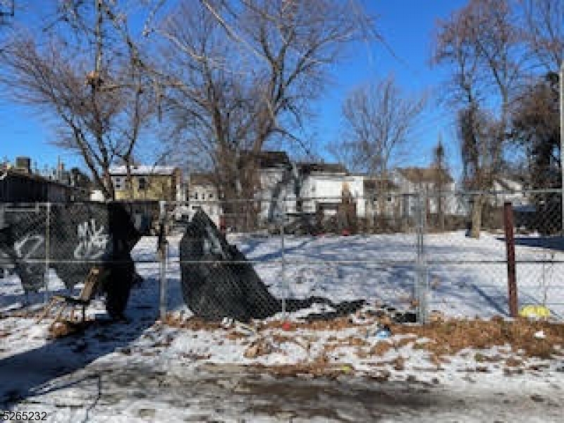 a view of a yard covered with snow in the yard