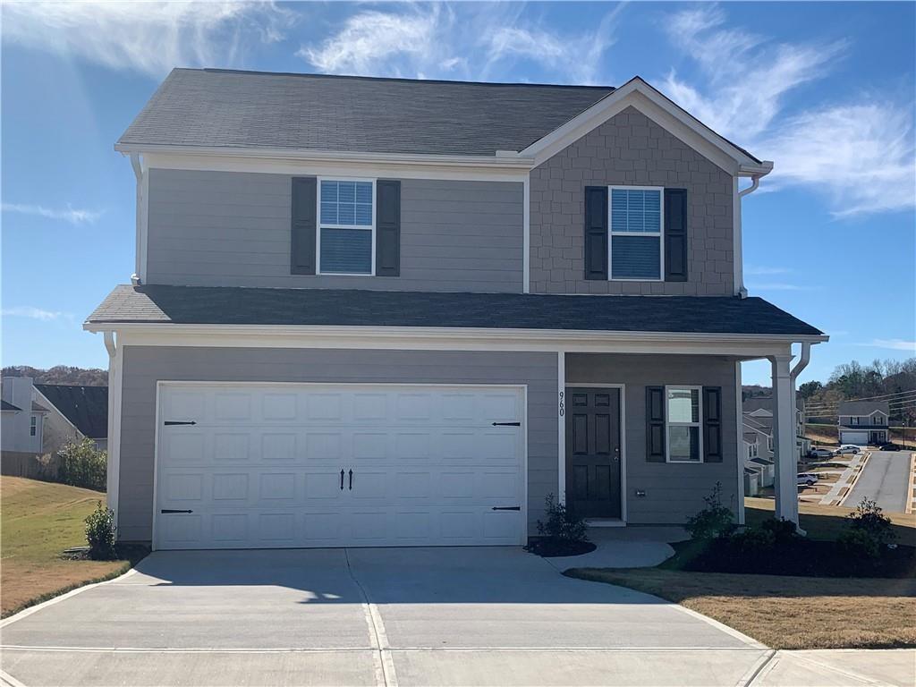 a front view of a house with a garage