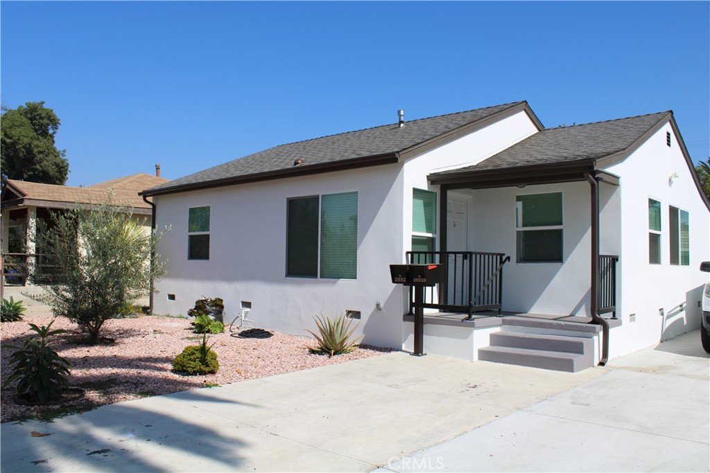 a front view of a house with a outdoor space