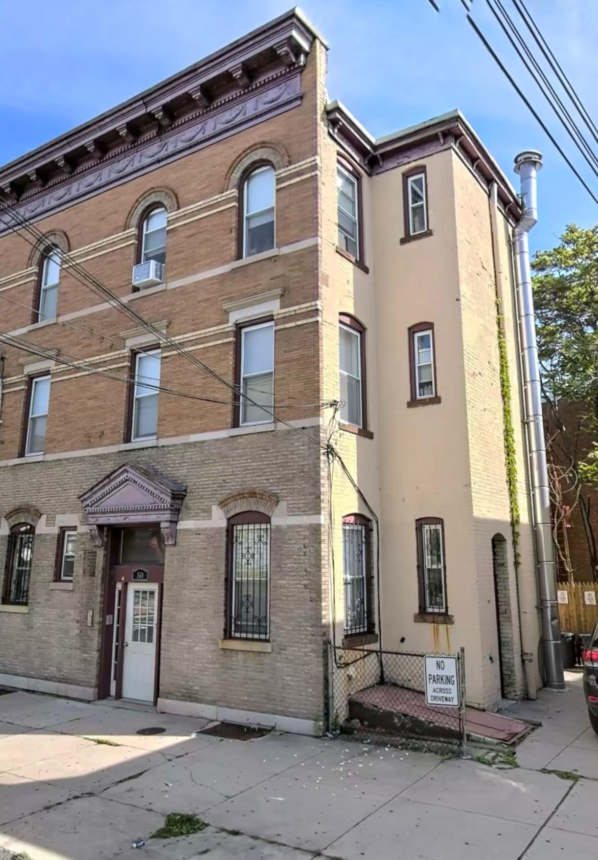 a front view of a house with parking